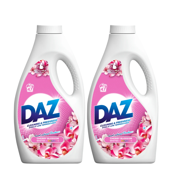 Two bottles of DAZ Cherry Blossom laundry detergent on a white background