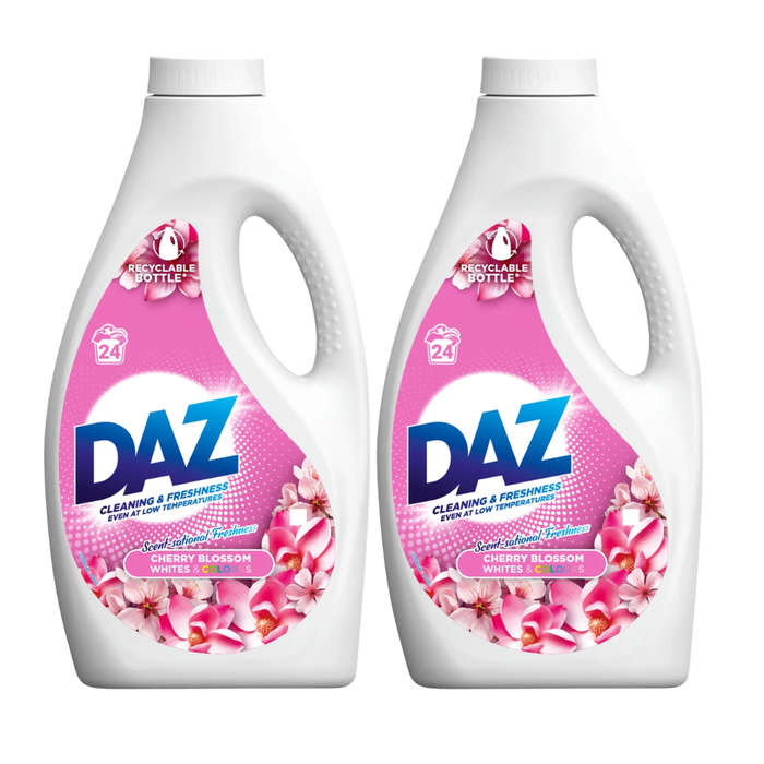 Two bottles of DAZ laundry detergent with cherry blossom design on a white background