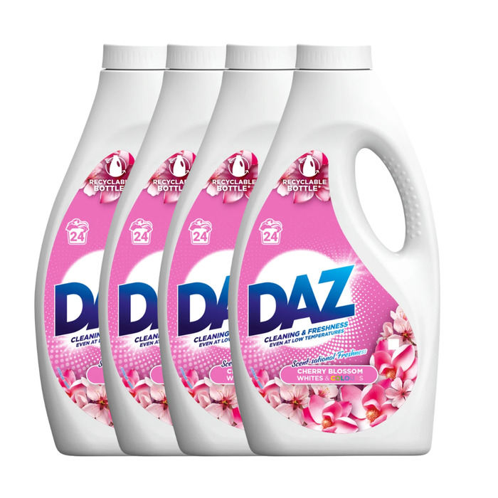 Four bottles of DAZ laundry detergent with a floral design on the label.