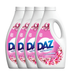 Four bottles of DAZ laundry detergent with a floral design on the label.