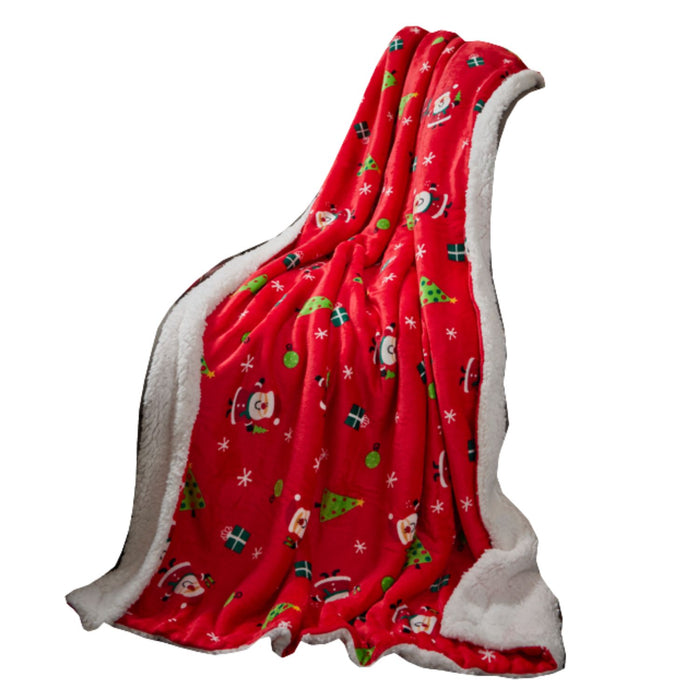 A red fleece blanket with a white sherpa lining, decorated with a festive Christmas print featuring Santa Claus, snowmen, Christmas trees, and snowflakes.