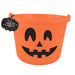 An orange plastic Halloween bucket with a black jack-o'-lantern face and a black hanging tag that reads 'FANETASTIC'.