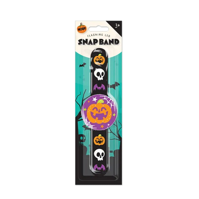Halloween-themed flashing LED snap band in retail packaging, featuring a black band with pumpkin, skull, and bat graphics, plus a purple circular insert with a jack-o'-lantern design.