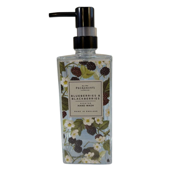 A bottle of Peashiffies London Blueberries & Blackberries Scented Hand Wash, featuring a botanical illustration of blueberries, blackberries, and white flowers on a pale blue background, with a black pump dispenser.