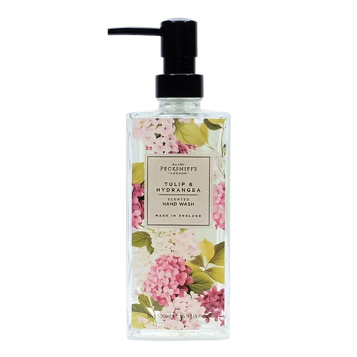 A clear rectangular bottle of Picknick's London Tulip & Hydrangea scented hand wash with a black pump dispenser, decorated with pink and white hydrangea flowers and green leaves on a white background.
