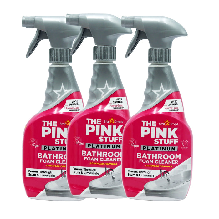 Three bottles of The Pink Stuff Platinum Bathroom Foam Cleaner by Star Drops arranged in a row against a white background.